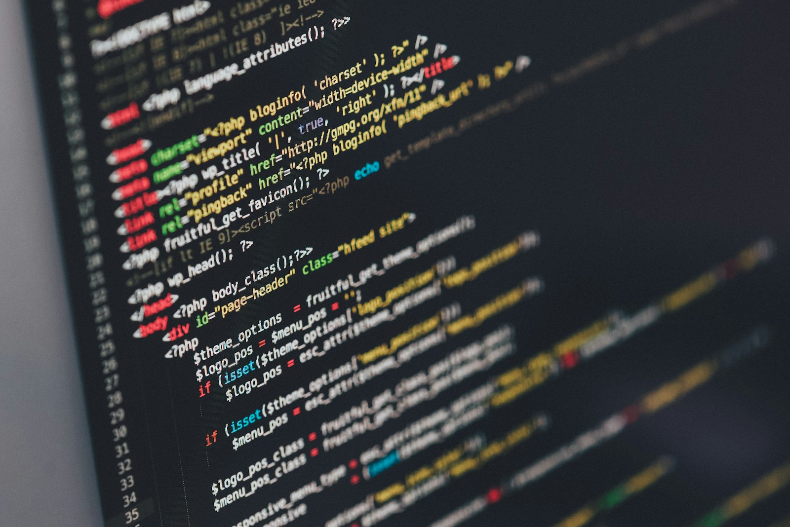 Close-up of syntax-highlighted source code on a dark monitor.